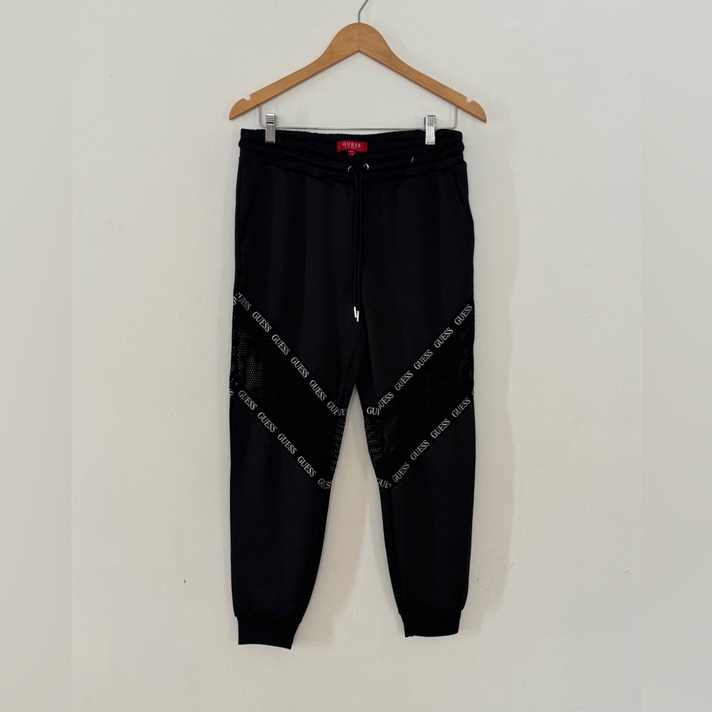 Guess woman’s jogger with Guess logo and mesh inserts